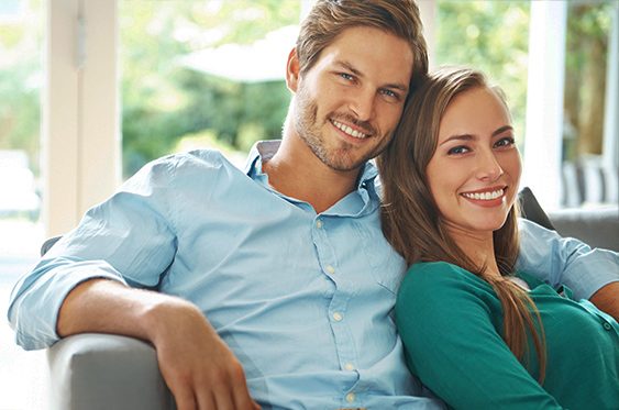 Patients smiling confidently after cosmetic dentistry near Bronxville, NY