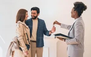Handing keys to new homeowners in Streamwood