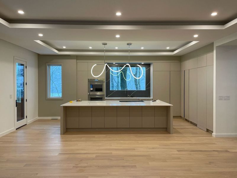 Modern kitchen lighting installed by Ryan Gath Electric near Massachusetts