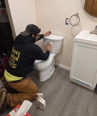 Brett Sabol Plumbing technician installing a toilet near Washington Crossing, PA